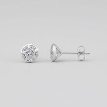 Load image into Gallery viewer, A single round stud earring with a white  marbled pattern, shown next to its silver butterfly back on a textured white background.

